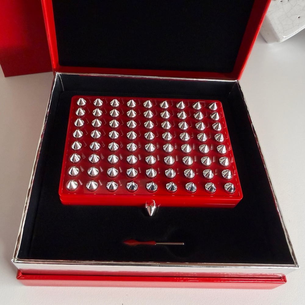 Christian Louboutin Red studded pallette case
